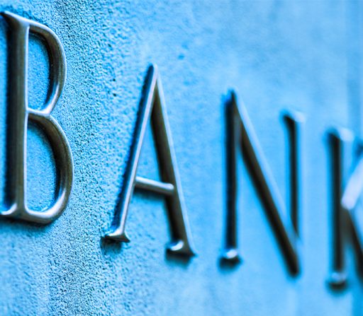 the word bank is on a stone wall