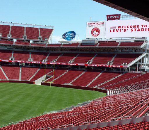 Levi's Stadium with red seats and a sign that says welcome
