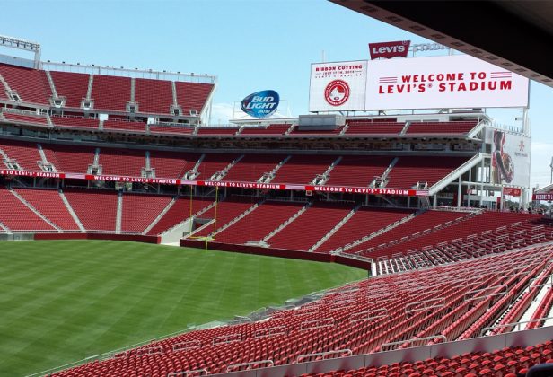 Levi's Stadium with red seats and a sign that says welcome