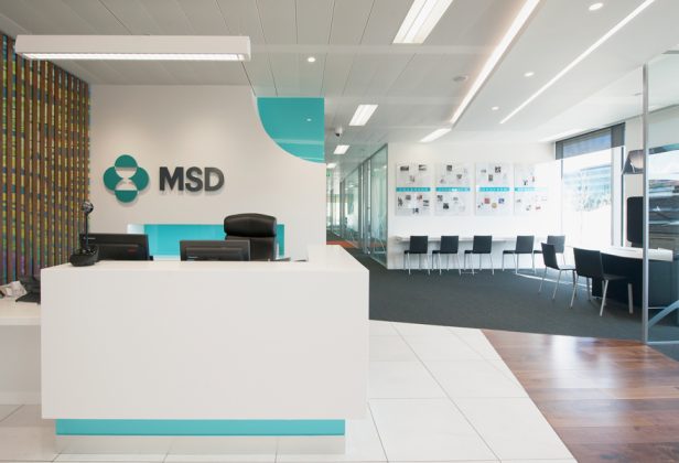 a msd sign is above a white desk