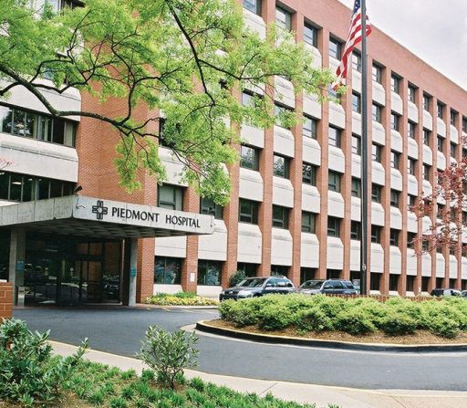 a large brick building with a sign that says Piedmont hospital