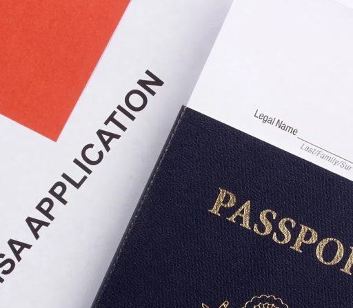 a passport sits next to a visa application