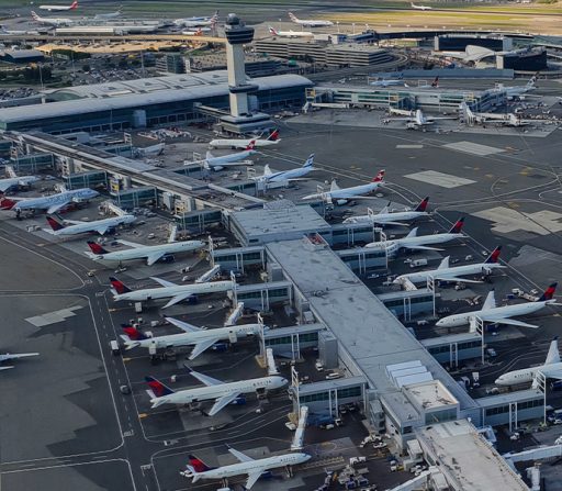 an aerial view of JFK airport with many planes parked