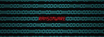 computer code with the word ransomware in red