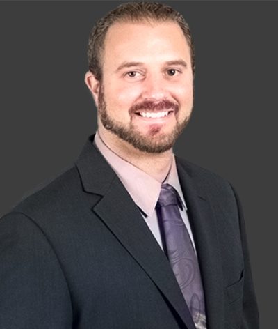 Jordan Ferrantelli in a suit and tie for a professional photograph