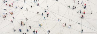 an aerial view of a large group of people connected by lines