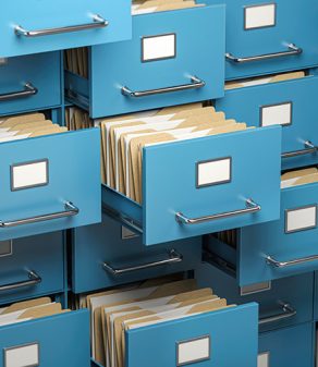 a stack of blue filing cabinets filled with folders and papers