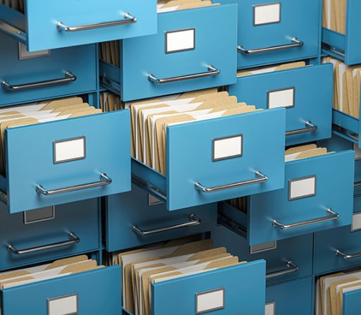 a stack of blue filing cabinets filled with folders and papers